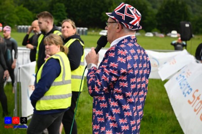 Brian Porter briefing people working at an outdoor event